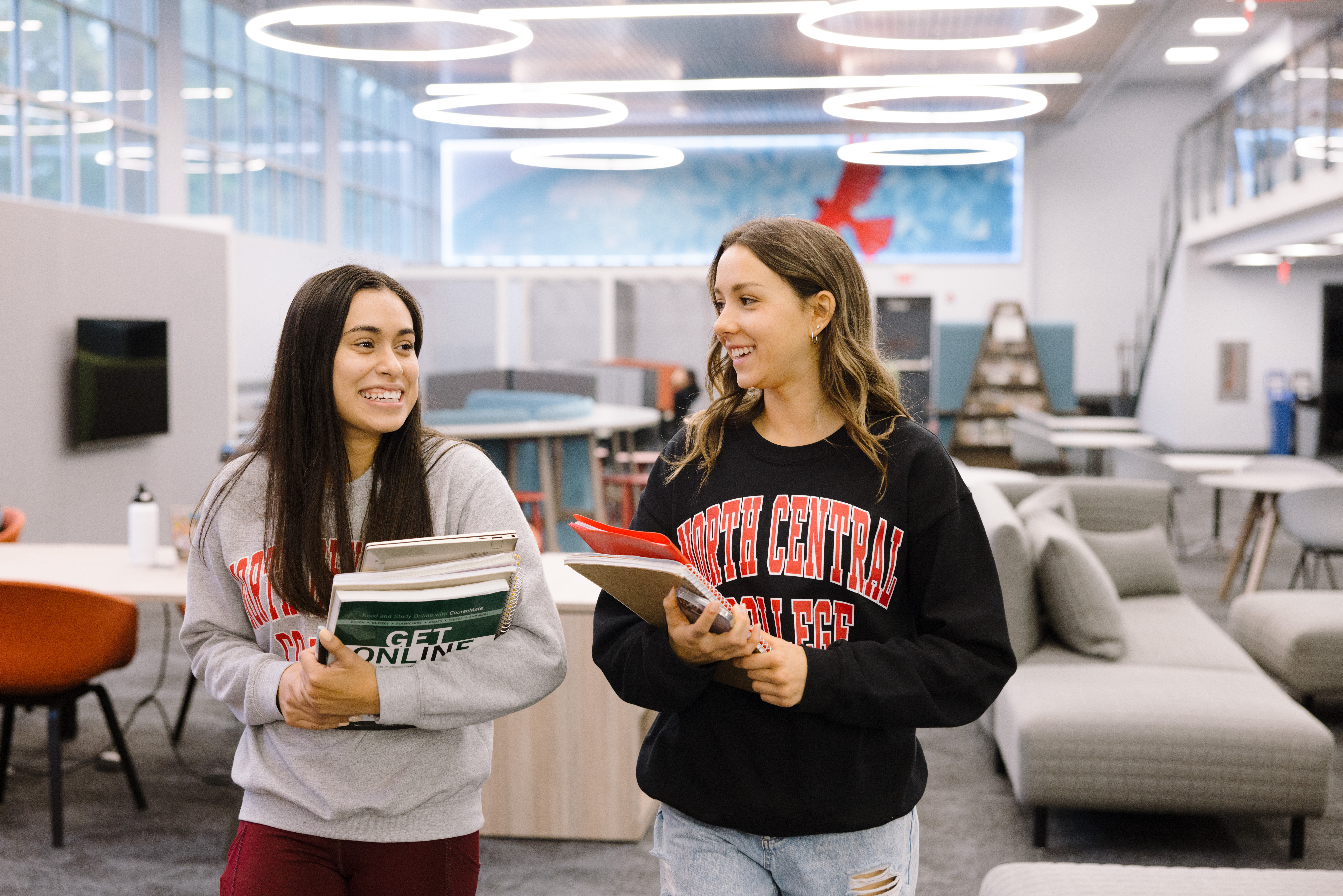 Students walking in the library