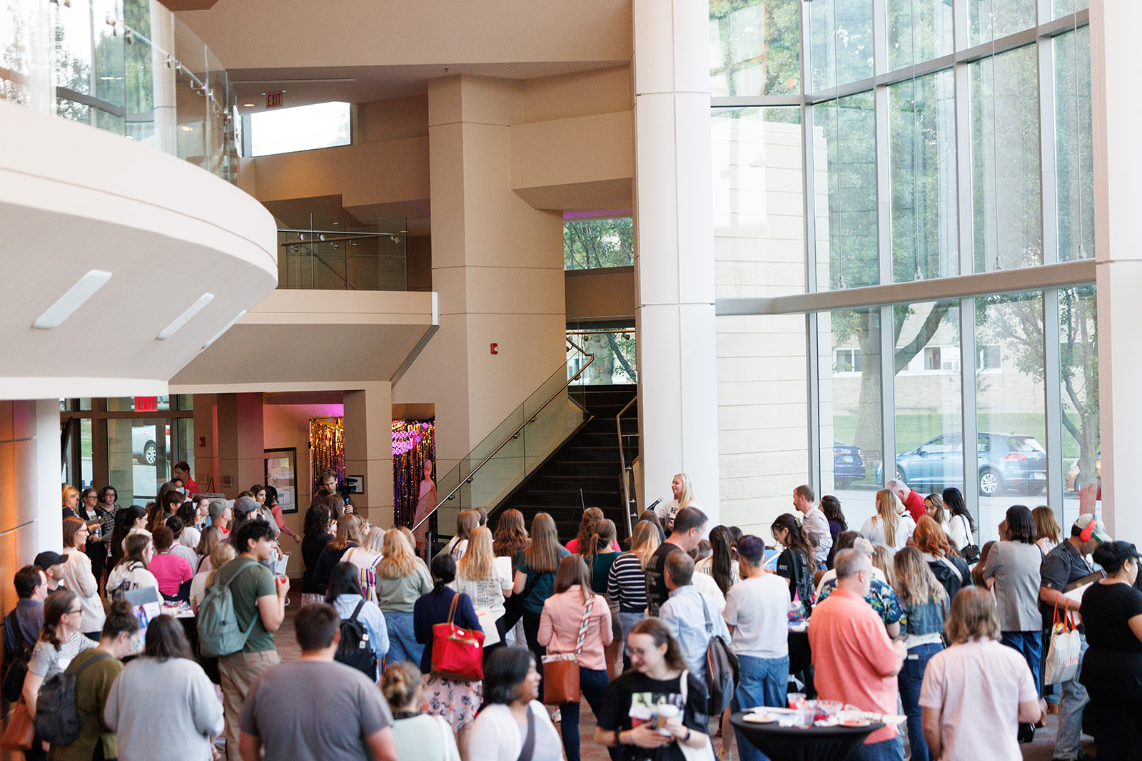 A large group of people standing in the lobby of Wentz Concert Hall.