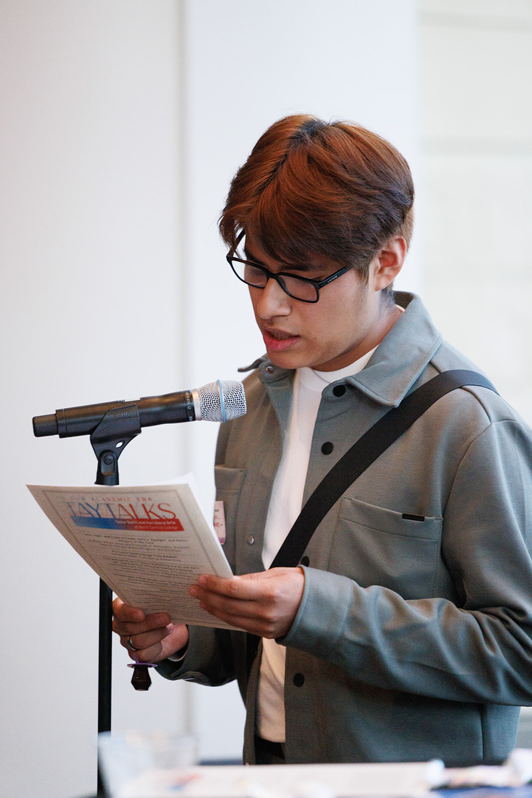 A male student presenting at the Tay Talks event.