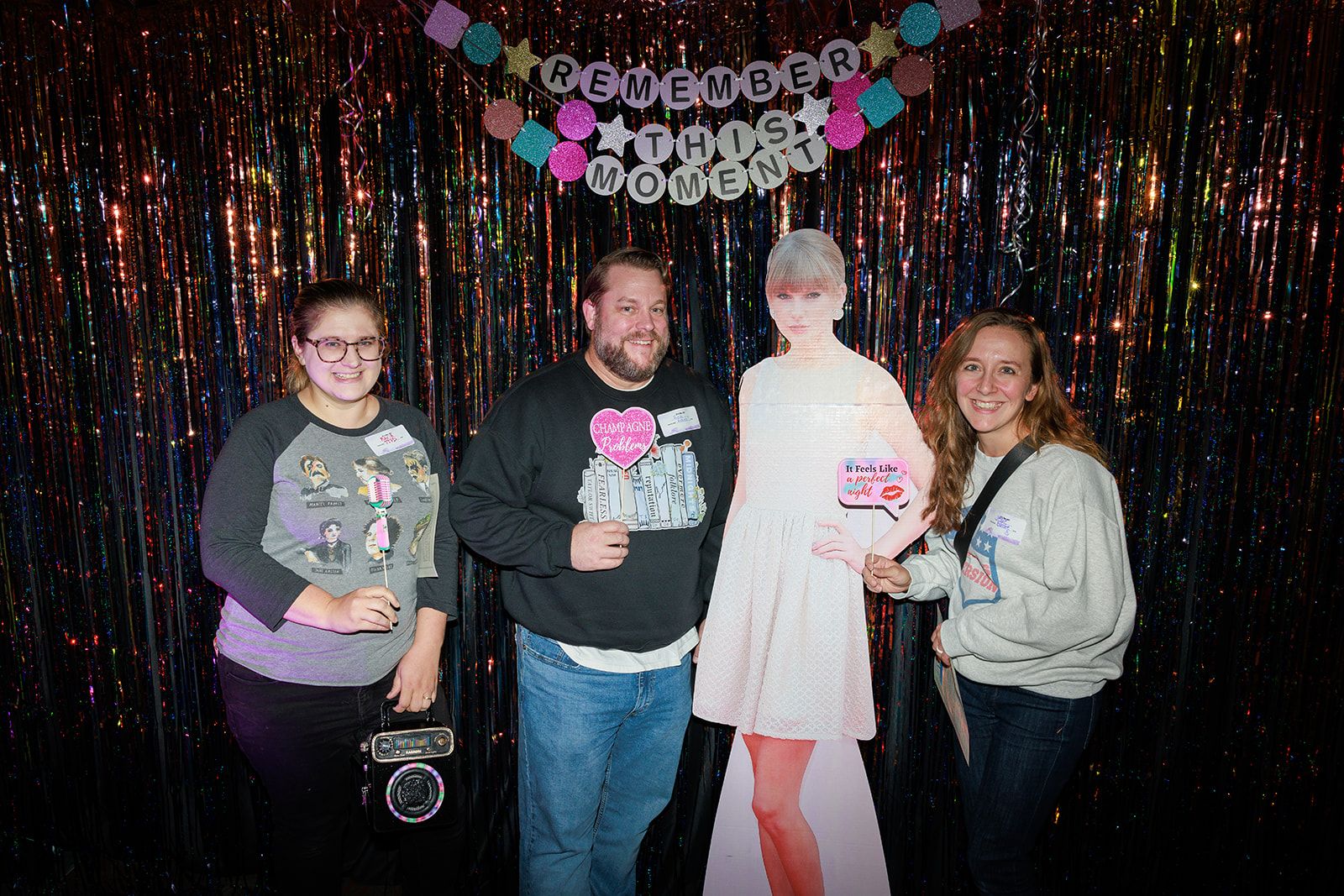 Students posing with a cutout of Taylor Swift.