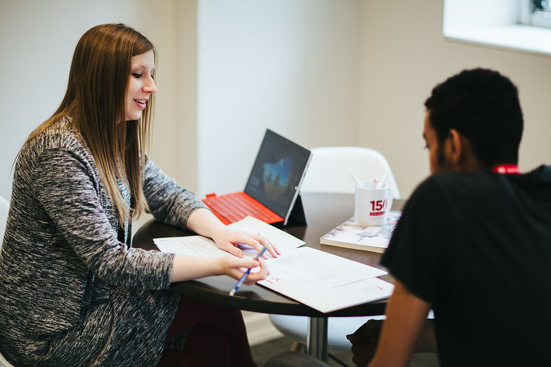 Admissions counselor talking with student