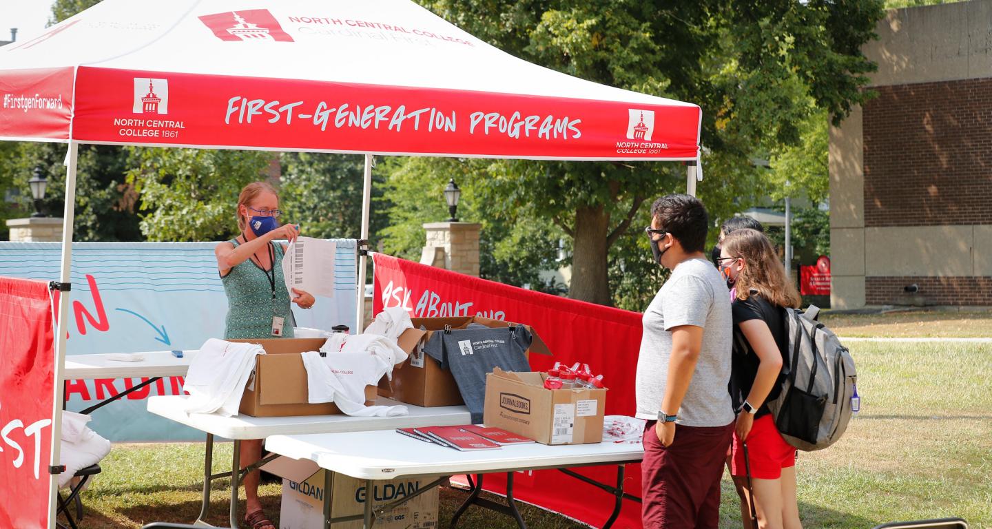 North Central College students asking staff about mental health resources.