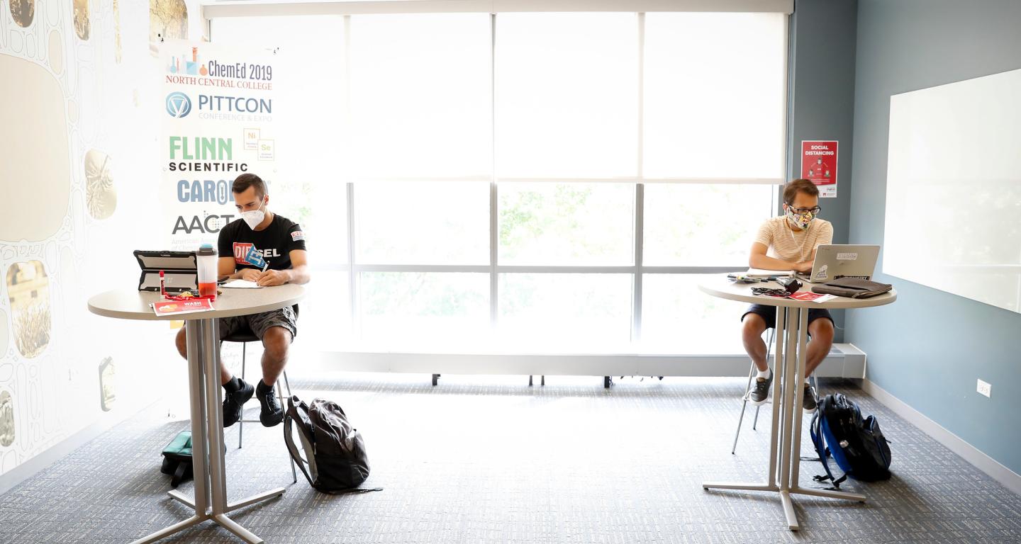 Two North Central College computer science students working on projects.