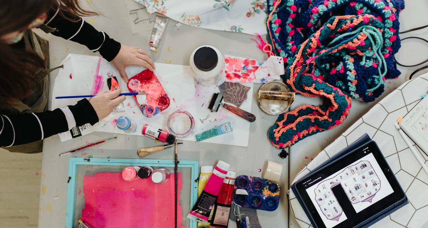 A North Central College student works on a graphic design project.