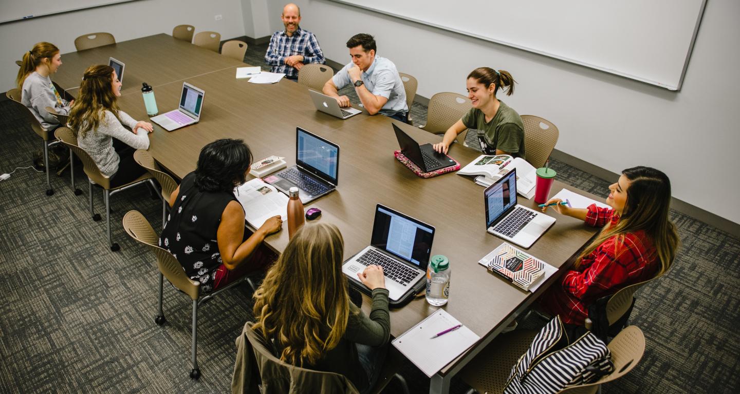 North Central College students meeting in a classroom.