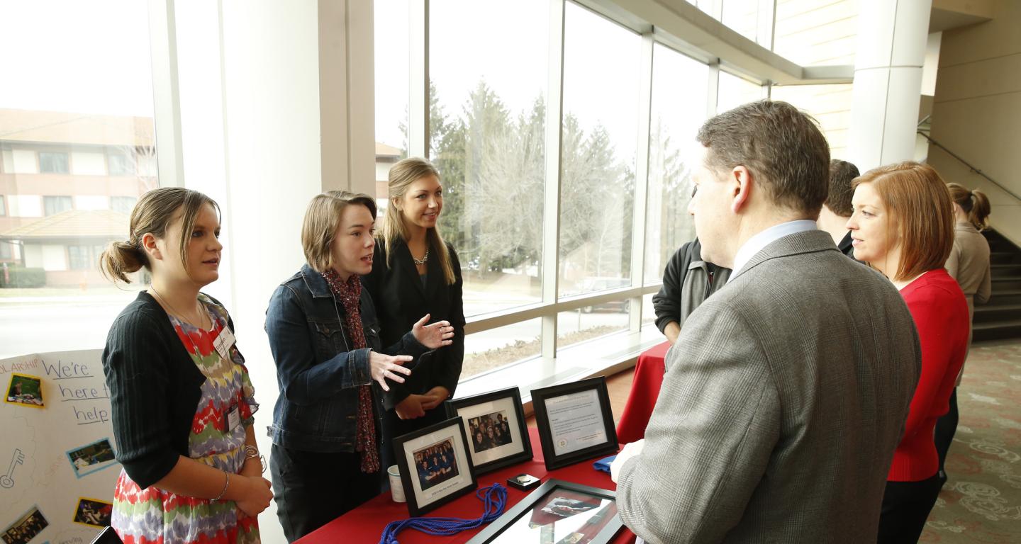 Students in the Blue Key Honor Society making a presentation.