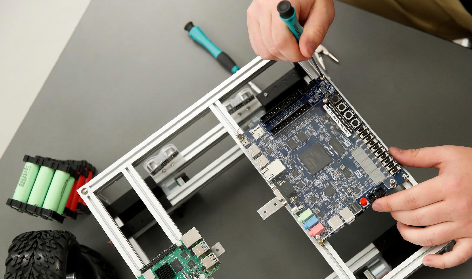 North Central College student William Jandak Jr. works on a circuit board.