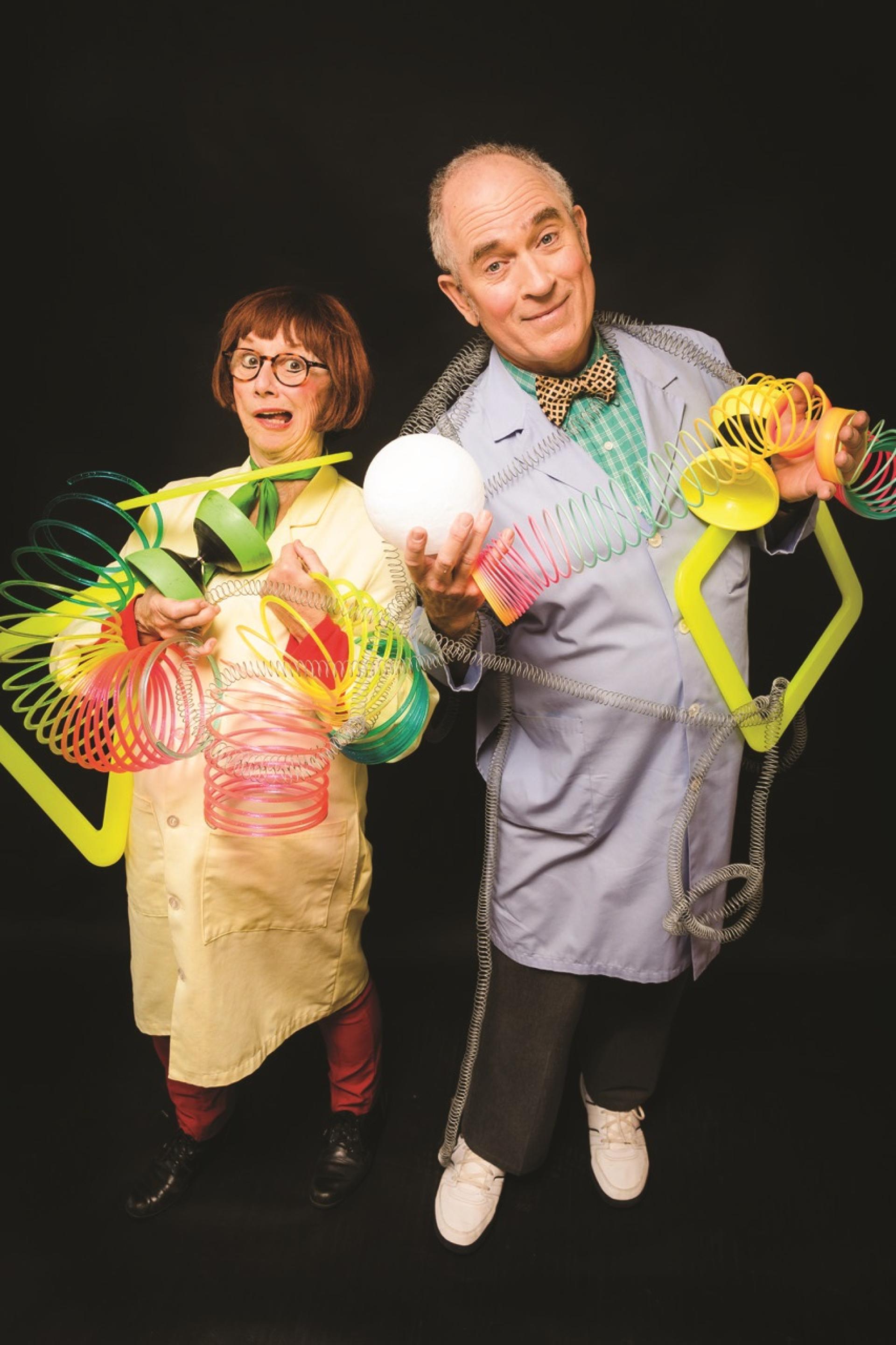 Two scientists holding Slinkys.