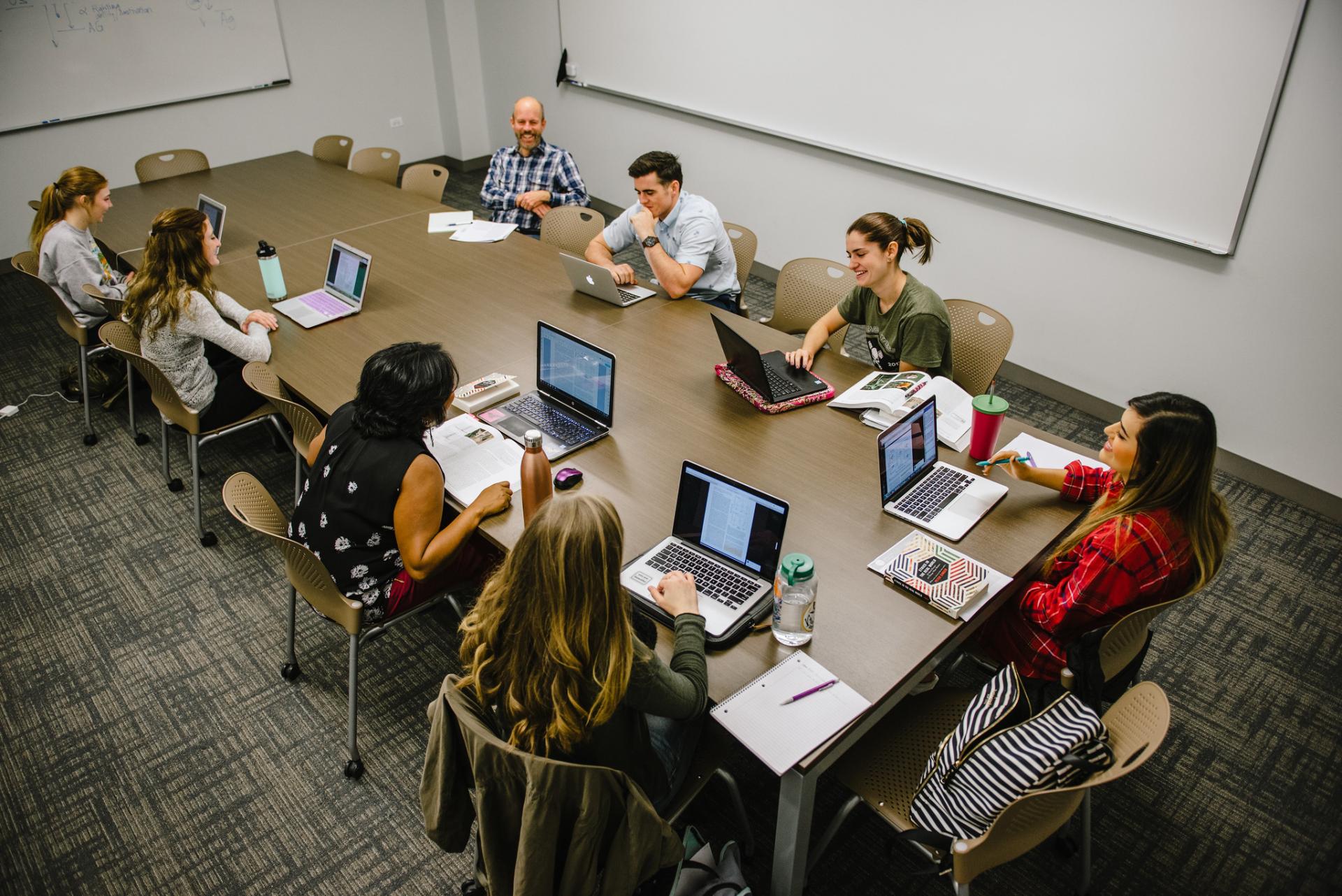 North Central College students meeting in a classroom.