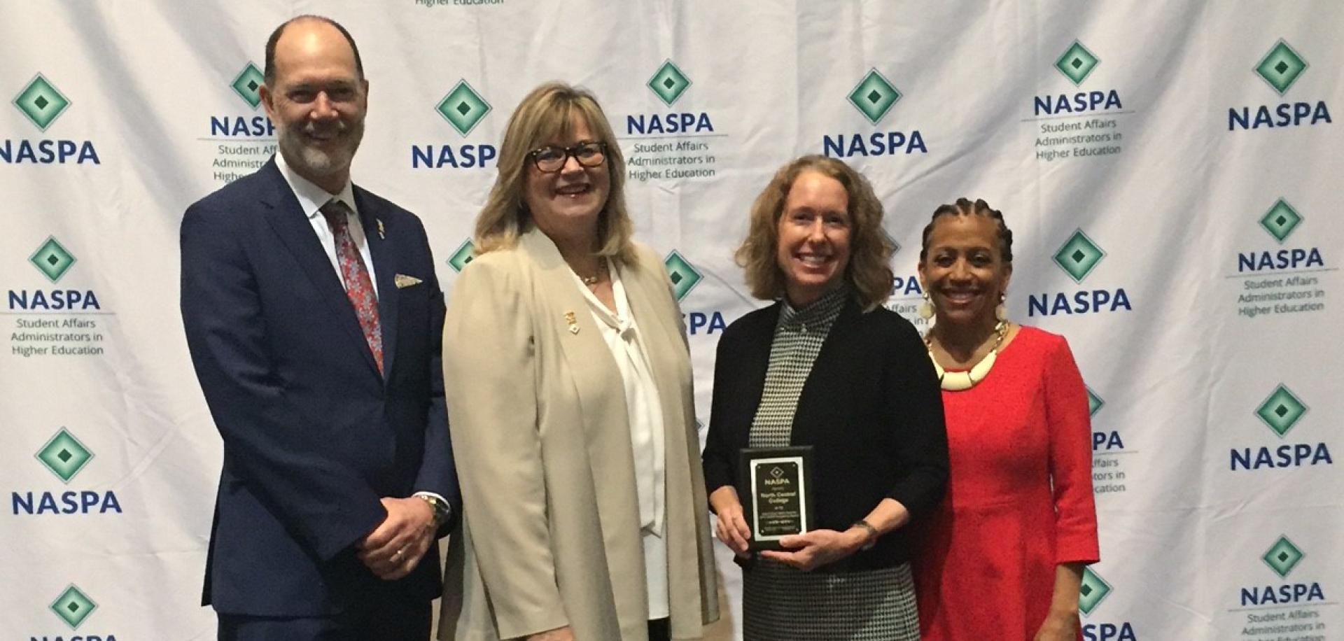 Pictured from left to right: NASPA President Kevin Kruger, NASPA Board Chair Dr. Deb Moriarty, Cardinal First Director Julie Carballo and Past NASPA Board Chair Dr. Lori White.