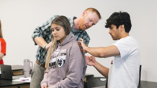 North Central College students doing a physical check-up.