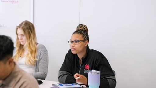 Physician Assistant student takes notes during a lecture